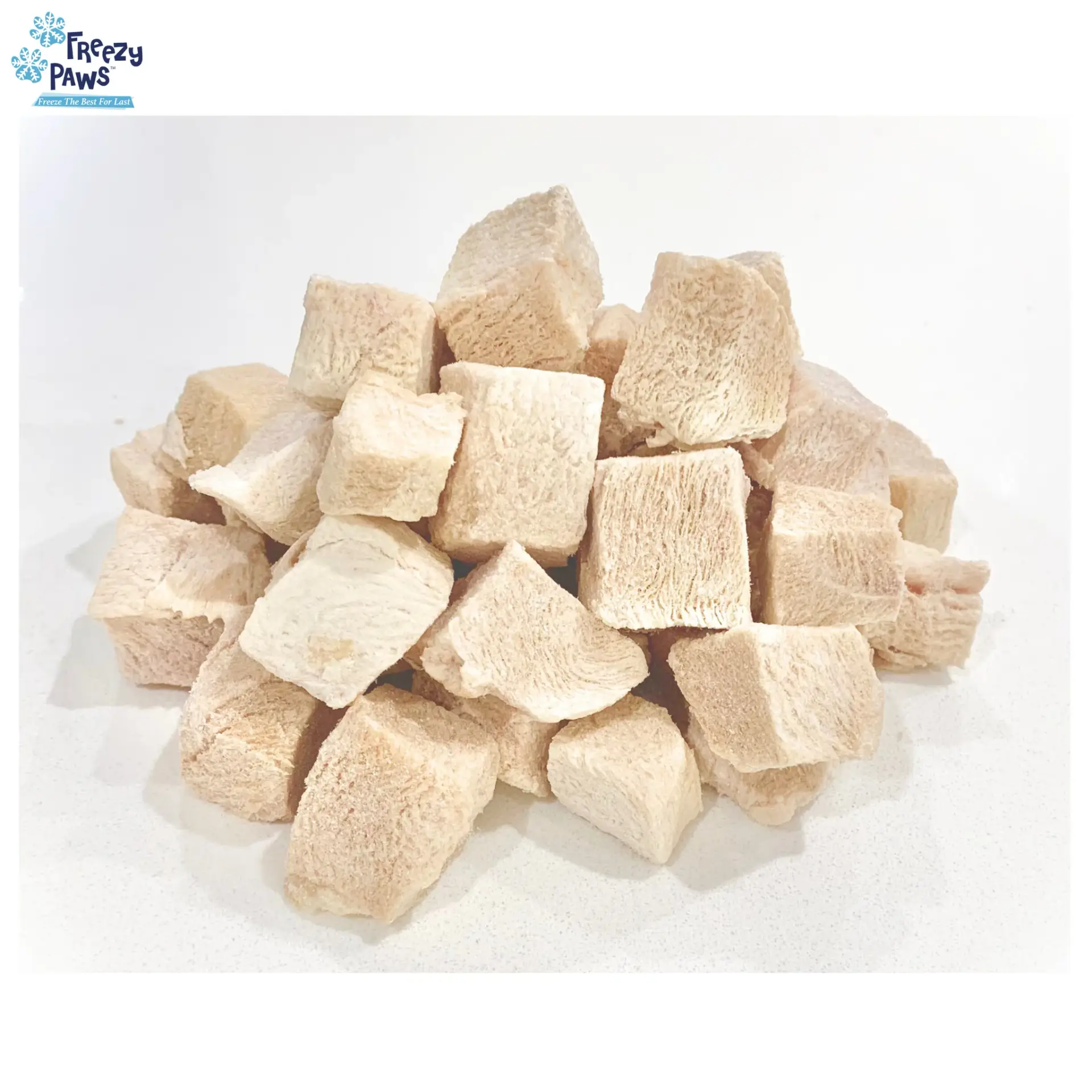 Freeze dried turkey breast dog treats close up showing cube shaped pieces