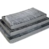 Stack of Arctic Faux Fur Superior Ortho Dog Mats in multiple sizes