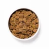 Bowl of air-dried turkey and flaxseed dog food pieces