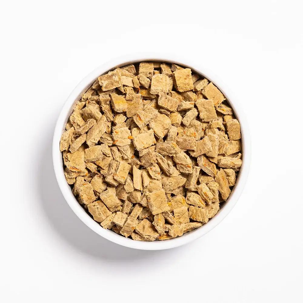 Air Dried Duck & Sweet Potato Dog Food Kibble Close-Up Bowl of air-dried duck and sweet potato dog food pieces