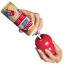 KONG Easy Treat Bacon & Cheese Dog Paste – Application Person filling a red KONG toy with KONG Easy Treat Bacon & Cheese Paste.
