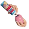 KONG Easy Treat Puppy Paste – Application Person filling pink KONG Puppy toy with KONG Easy Treat Puppy Paste.