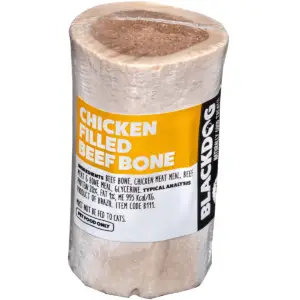 Close-up of chicken filled beef bone showing exposed centre and solid outer bone.
