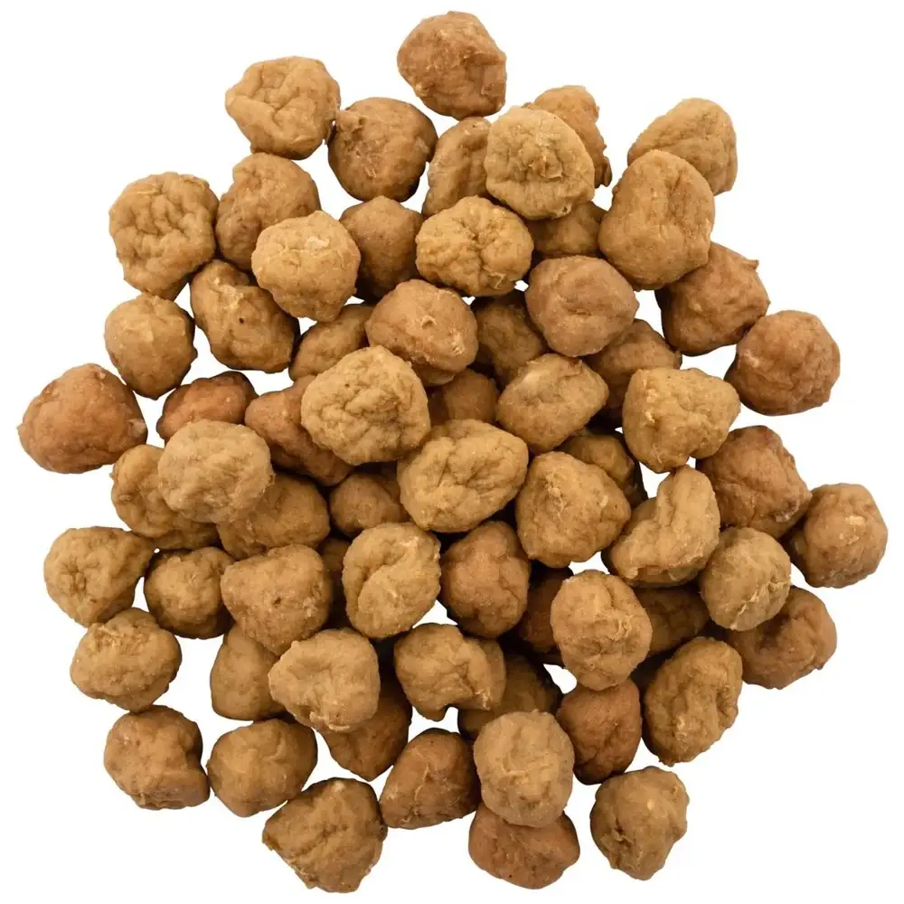 A pile of dried Chicken Meat Balls Dog Treats showing their soft, round texture.