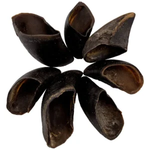 A group of Blackdog cow hooves dog treats arranged in a circle on a white background.