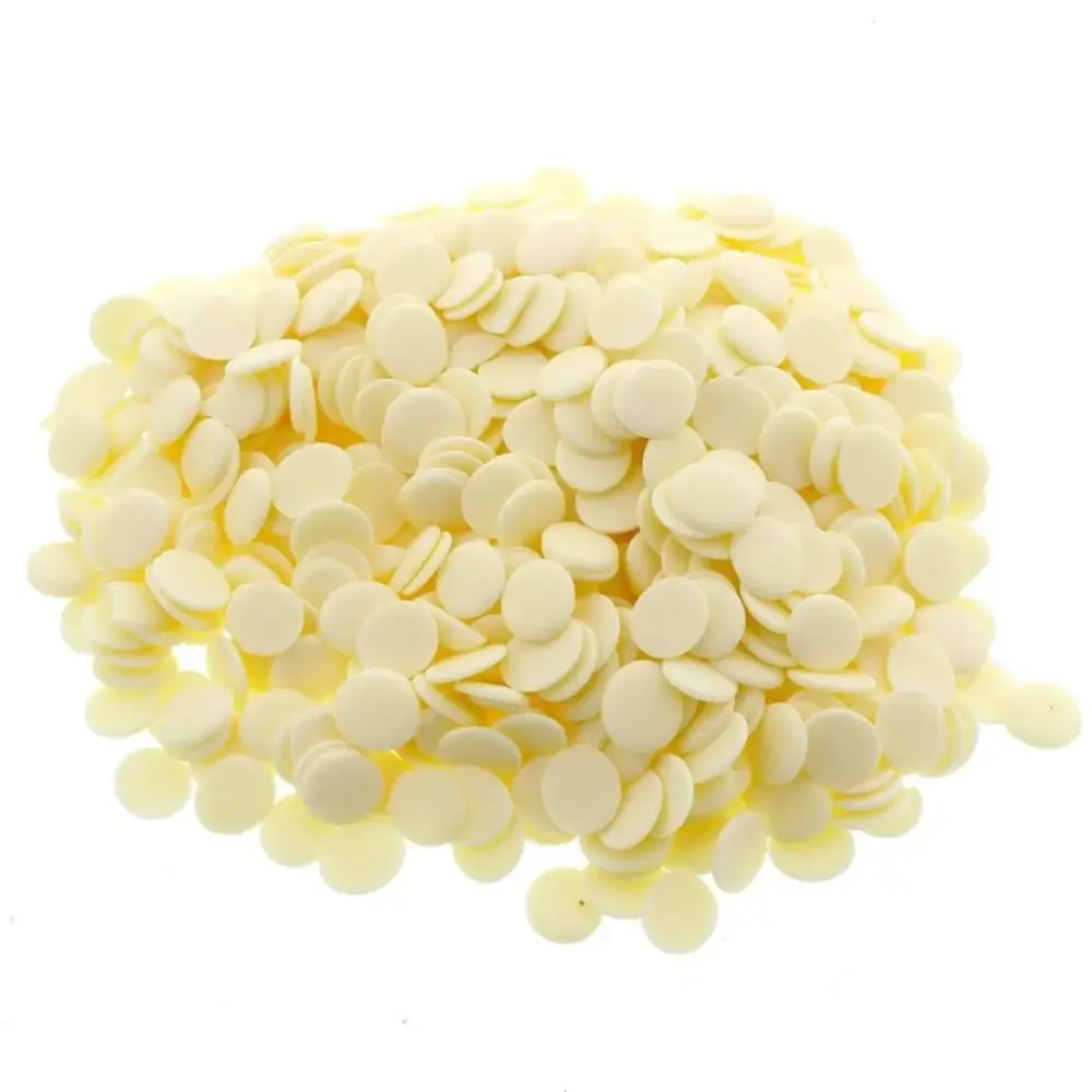 A pile of small round white yoghurt button dog treats.