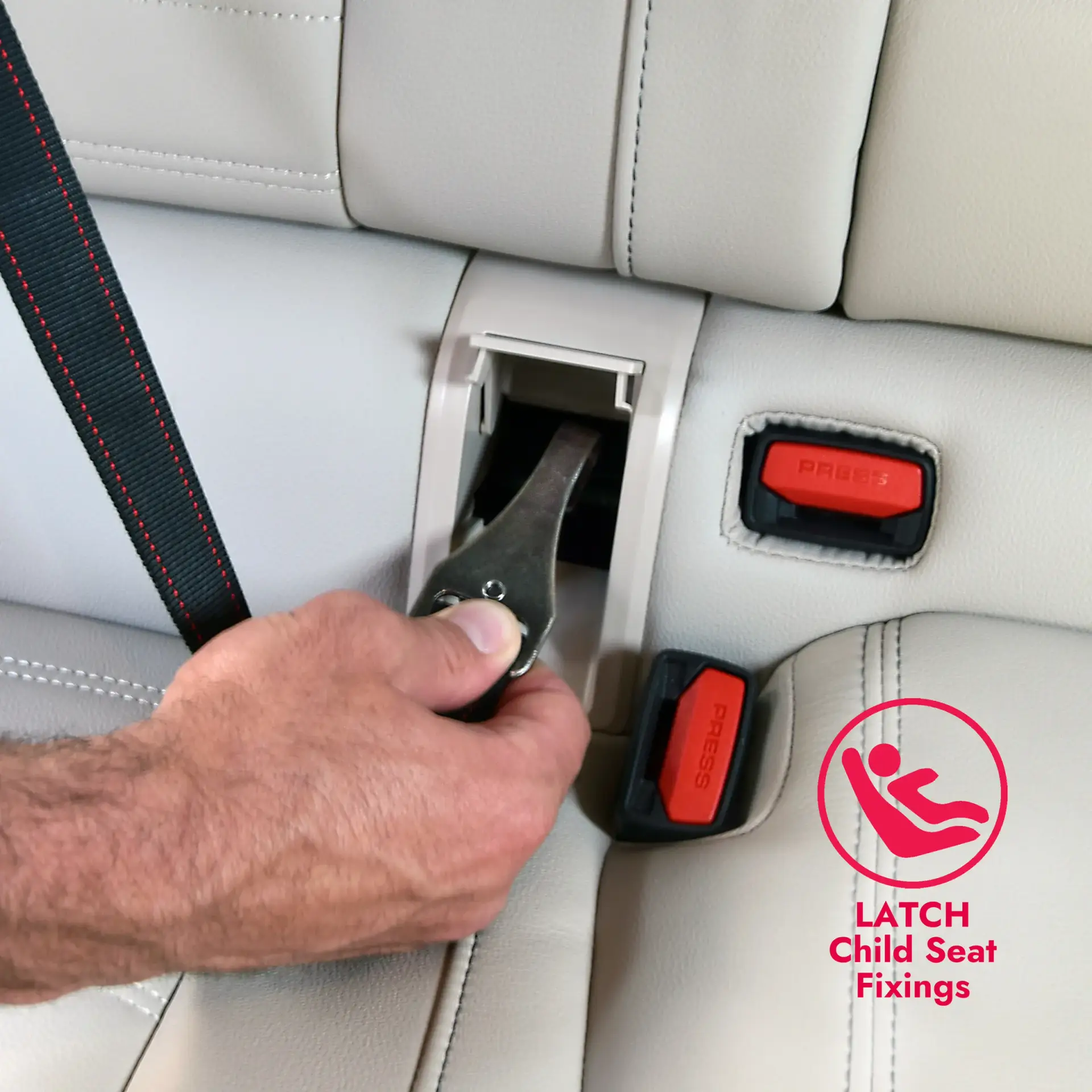 Close-up of the KONG Ultimate Safety Tether attaching to a car’s LATCH child seat anchor point