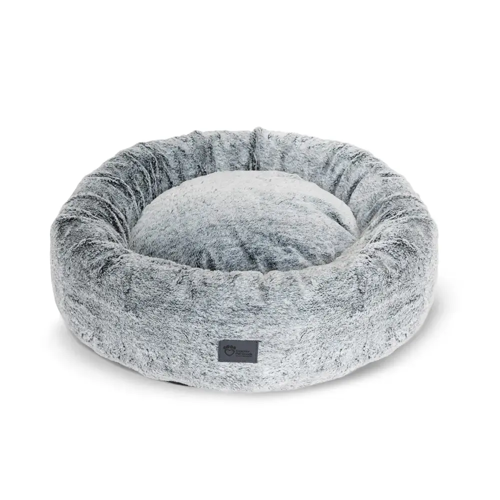 Angled view of the Superior Harley dog bed in arctic faux fur with supportive round shape